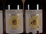 three bottles of wine that are sitting on a table
