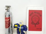 a bottle of fire extinguisser next to a small figure of a football player