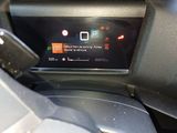 a car dashboard with a digital display on it