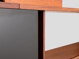 a close up of a wooden shelf with a television on it