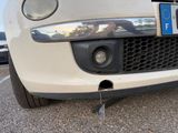 a close up of a car ' s front bumper with a license plate on it