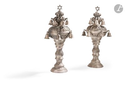 pair of silver plated candlesticks with figures on them