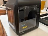 a black microwave sitting on a counter in a kitchen