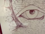 dessin d'un œil sur une feuille de papier sur laquelle figurent des inscriptions