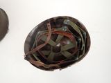 an image of a helmet is sitting on a table next to a pair of shoes