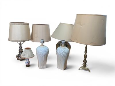 three lamps that are sitting next to each other on a table