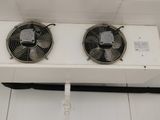 two fans that are attached to the ceiling