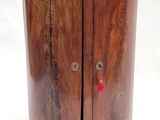 an image of a small wooden cabinet with a marble top