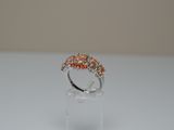 a close up of a ring sitting on top of a white table