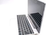 a laptop computer with a keyboard on a white surface