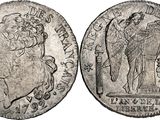 a silver coin with an image of a man holding a sword