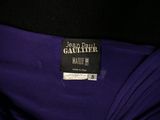 a close up of a purple dress with a label on it