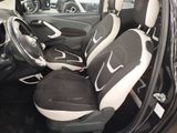 a picture of the interior of a car with black and white seats