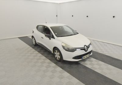 the white car is parked in the garage on the checkered floor