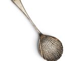 a close up of a spoon on a white surface