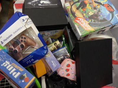 a pile of toys and games in a shopping cart