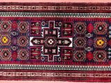 a close up of a rug on a pink background