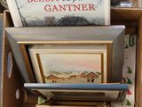 a box full of books and pictures in it