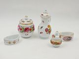 four pieces of porcelain tea set including a teapot, cups and saucer