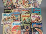 a lot of comic books on the table together