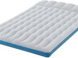 a close up of a mattress that is on a white surface