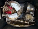 a silver container with a red light inside of it