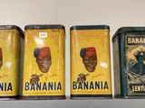 three tins of bananas are sitting on a shelf next to each other