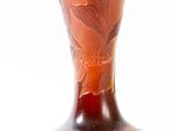 a brown vase with a brown design on it