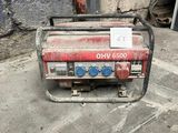 a small generator that is sitting on the ground