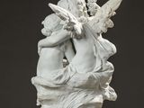sculpture of two cherenskers embracing each other on a table