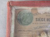 a picture of a piece of paper with a coin in it
