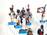 many figurines of soldiers on display in a display case