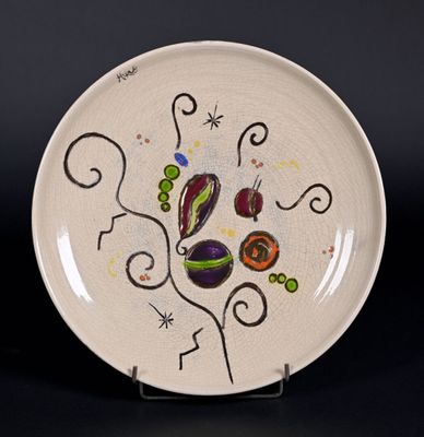 Plat circulaire en céramique émaillée de motifs géométriques…