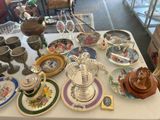 a table that has a lot of plates and cups on it