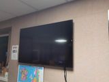 a flat screen tv mounted on a wall in a room