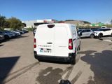 a white van that is parked in a parking lot