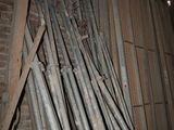a lot of pipes that are stacked up in a room
