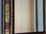 a mirror hanging on the wall in a room