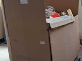 a large cardboard box on a pallet in a warehouse
