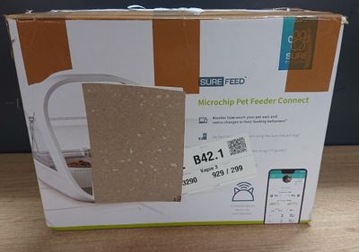 the box of the microwave is open on the table