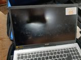 a laptop computer sitting on top of a suitcase