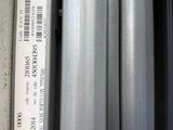 a close up of a bunch of metal pipes on a shelf