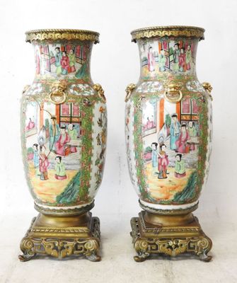 pair of antique chinese vases on stands with asian scenes