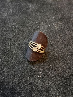 an image of a ring that is on top of a stone