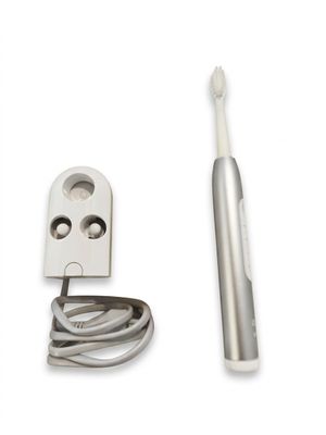 an image of a toothbrush with a cord attached to it