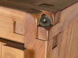 a close up of a wooden cabinet with a drawer