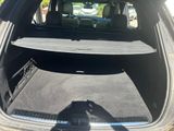 the back of a car with the trunk open and the back of the car in the back