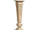 a tall pedestal with a carved design on it