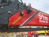 a red crane that is sitting on the ground