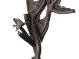 sculpture en bronze représentant un oiseau perché sur une branche d'arbre